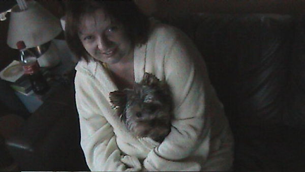 Yorkie loving a cuddle